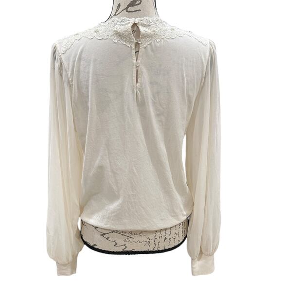 Anthropologie Tiny Long-Sleeve
Mock-Neck Lace Embellished Top - Picture 5 of 9